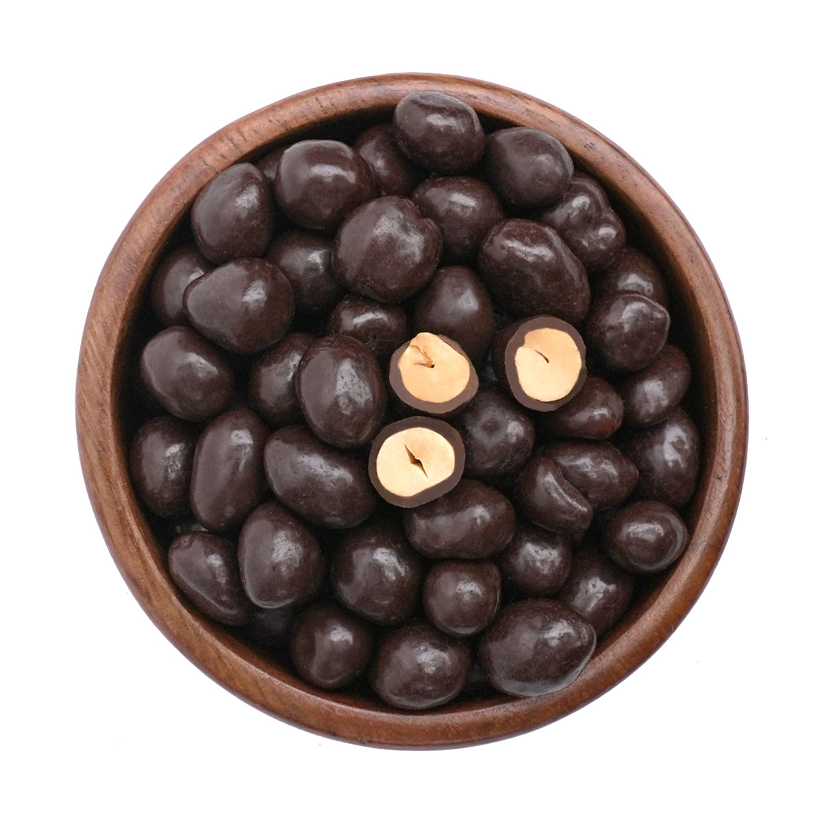 schokolierte Erdnüsse mit Zartbitterschokolade in Holzschale