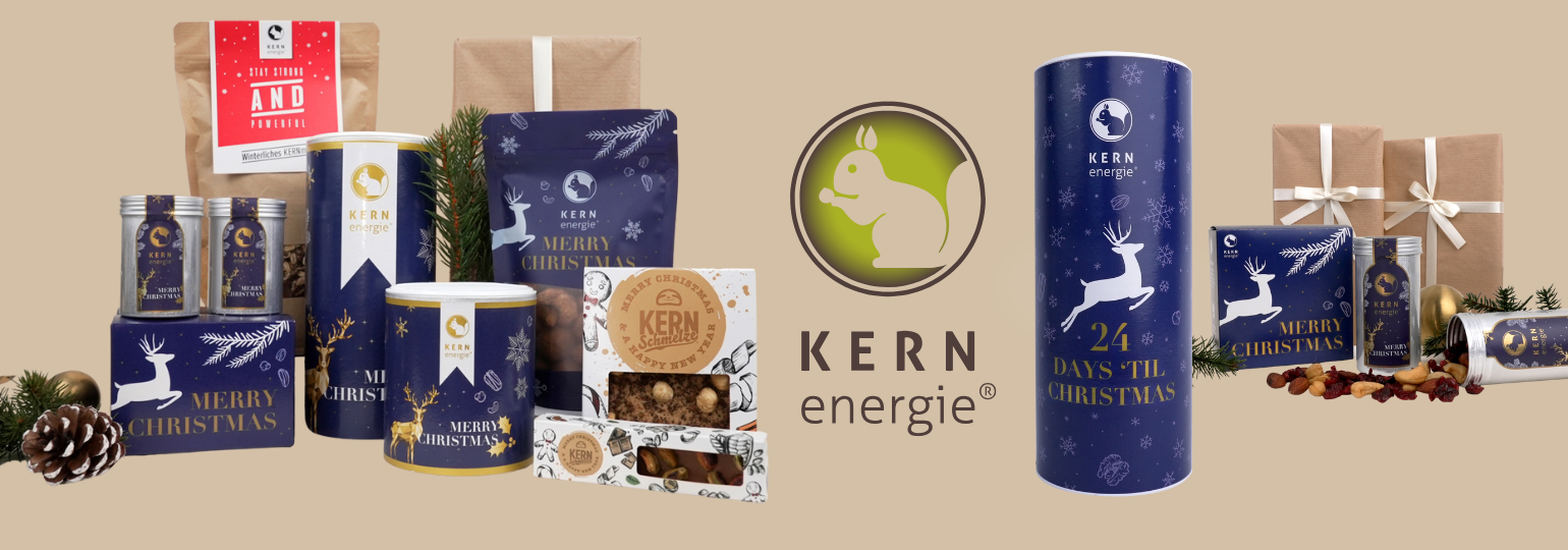 Große Auswahl an stilvoll verpackten Weihnachtsgeschenken 2025 mit Logo – Geschenksets mit Nüssen, Schokolade und Pappdosen im festlichen Design für Kunden und Mitarbeitende.